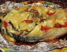 Dishes of fish and champignons Red fish baked in the oven with mushrooms